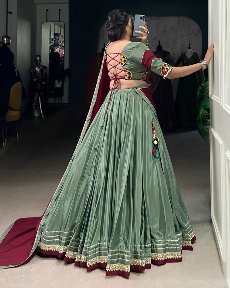 Graceful Green And Maroon Silk Crape Lehenga Choli With Elegant Dupatta