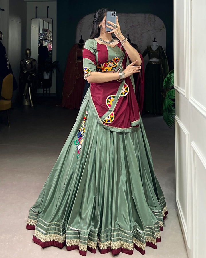 Graceful Green And Maroon Silk Crape Lehenga Choli With Elegant Dupatta