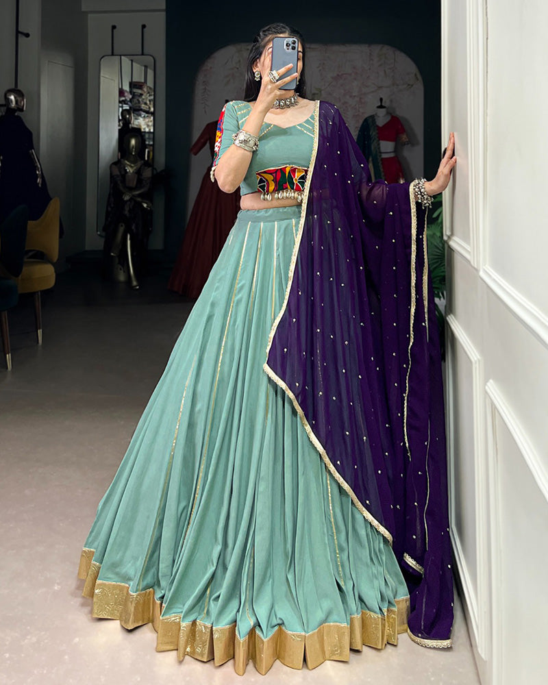 Sea Green Color Rayon Embossed Navratri Lehenga Choli