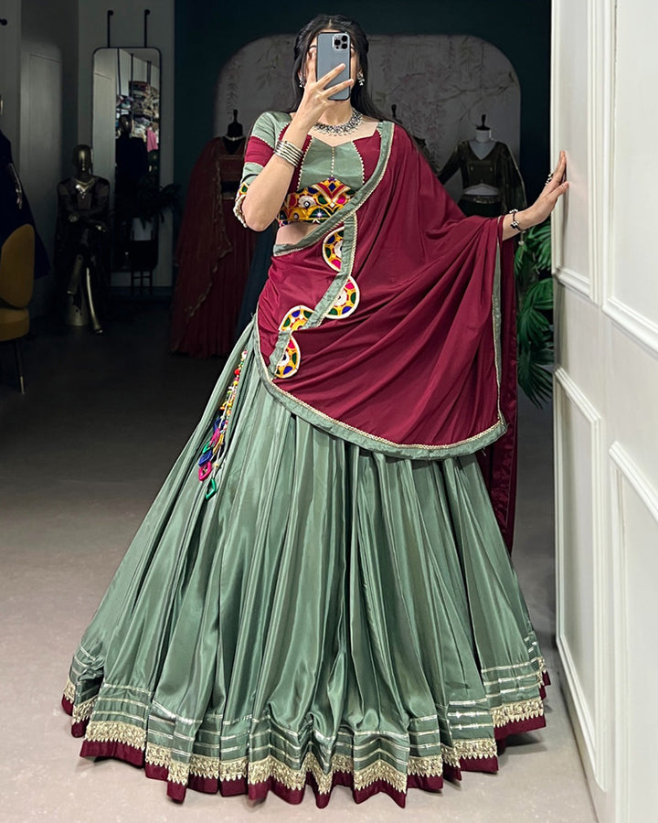 Graceful Green And Maroon Silk Crape Lehenga Choli With Elegant Dupatta