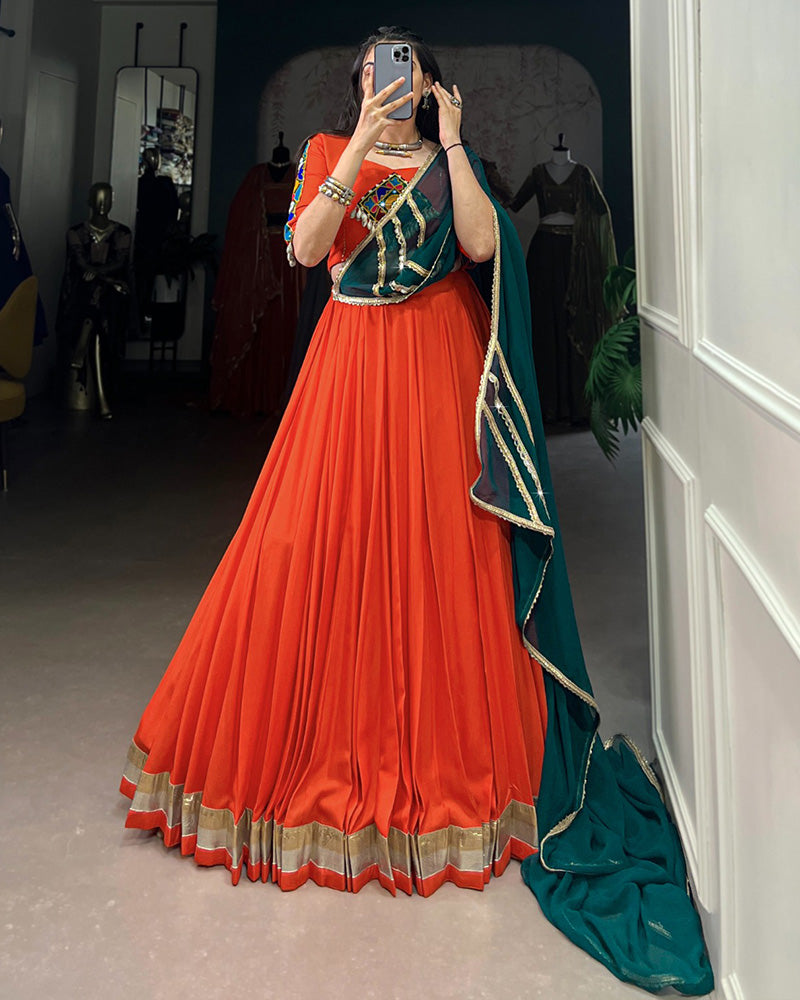 Orange Color Rayon Embossed Navratri Lehenga Choli