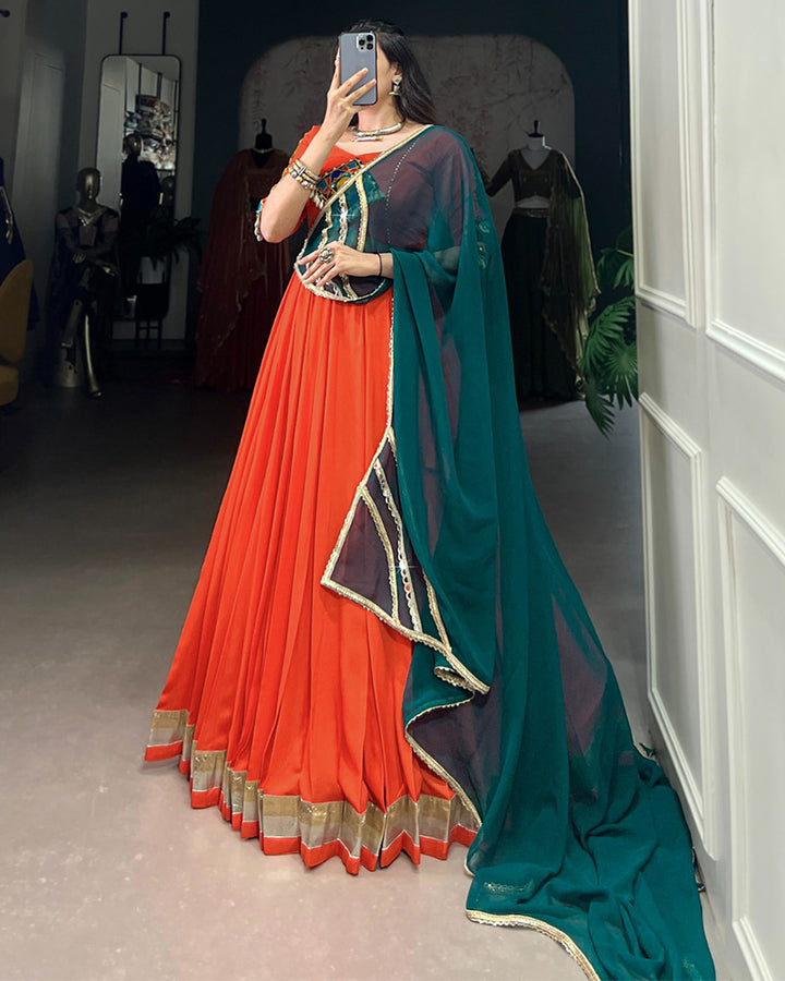 Orange Color Rayon Embossed Navratri Lehenga Choli