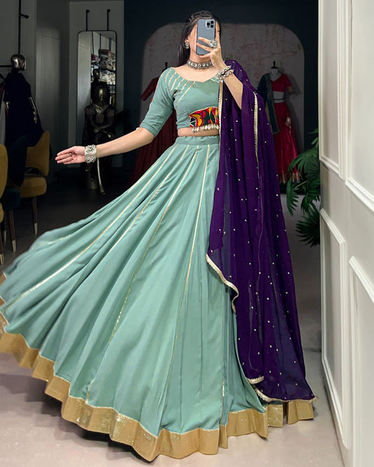 Sea Green Color Rayon Embossed Navratri Lehenga Choli