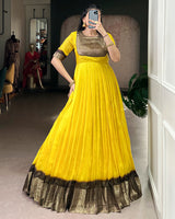 Yellow Color Mass Mello Zari Weaving Gown