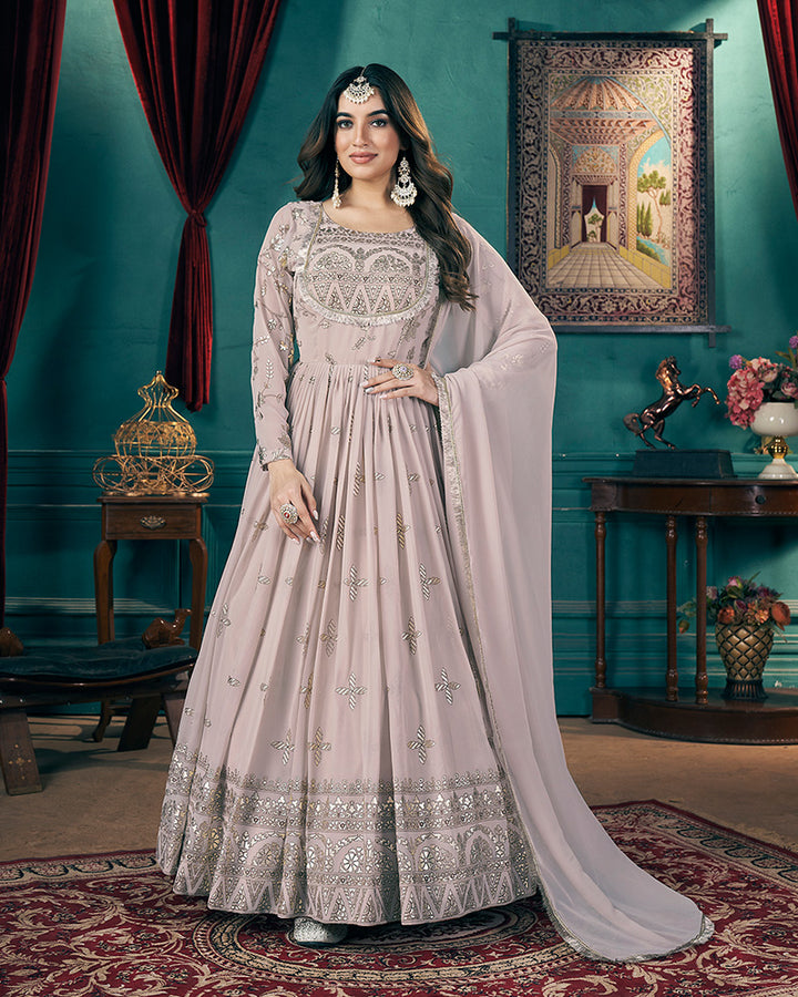 Chiku Color Faux Georgette Metalic Foil Work Gown With Dupatta