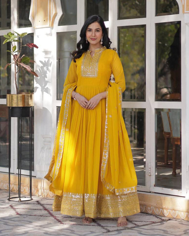 Yellow Color Faux Blooming Rich Embroidered Work Gown