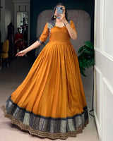 Mustard Color Dola Chex Zari Weaving Gown