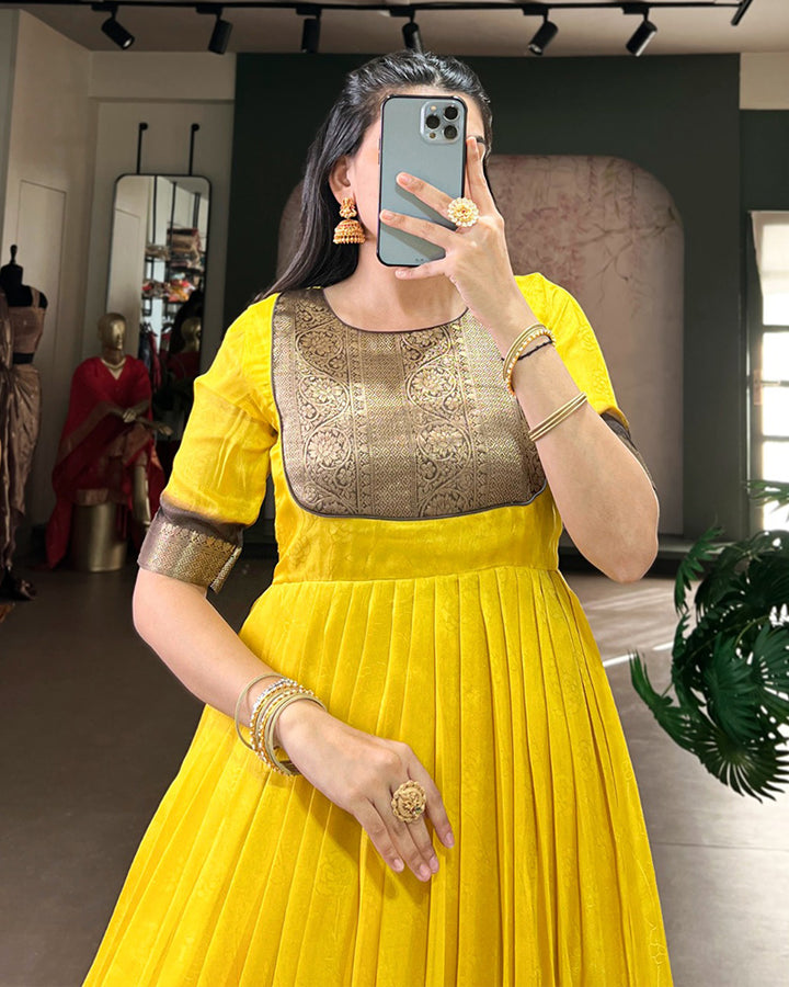 Yellow Color Mass Mello Zari Weaving Gown
