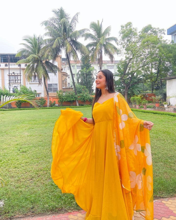 Neha Ghosh in Mustard Yellow Color Soft Georgette Anarkali Gown With Floral Printed Dupatta