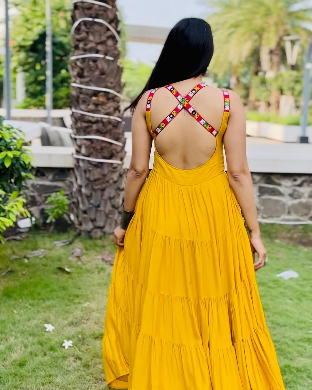 Krishna Patel In Mustard Yellow Color Full Flairy Rayon Navratri Backless Gown