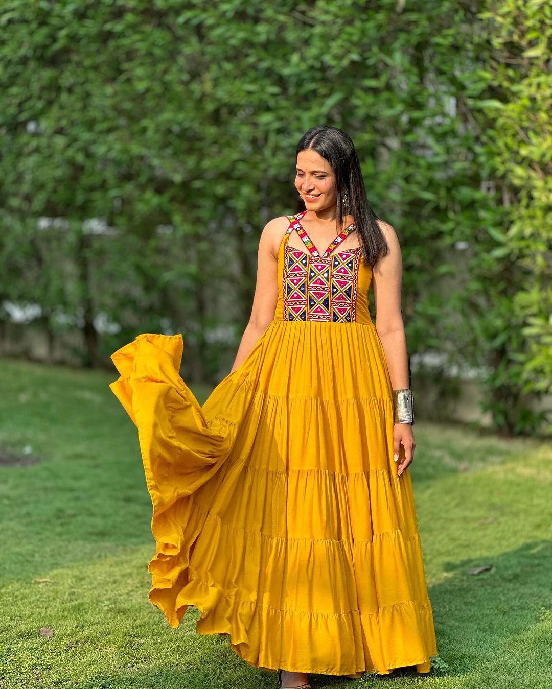 Krishna Patel In Mustard Yellow Color Full Flairy Rayon Navratri Backless Gown